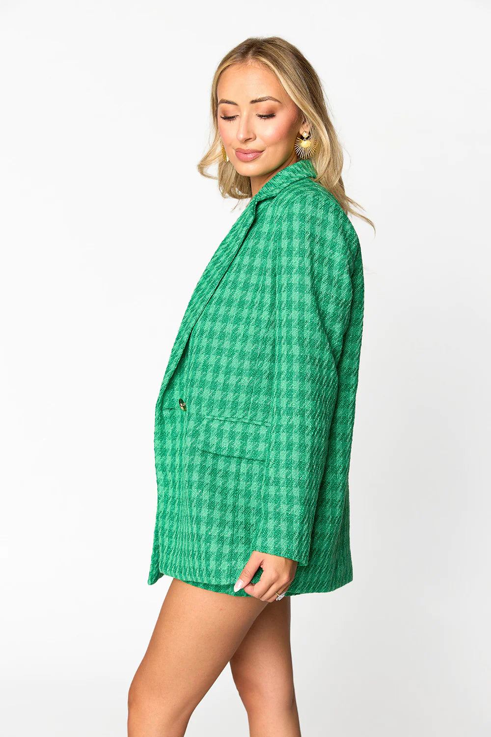 a woman in a green checkered coat