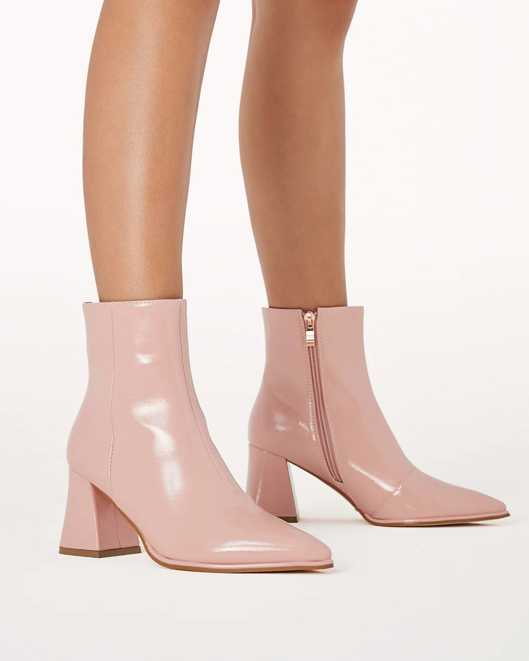 a close up of a person wearing pink boots