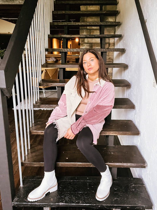 a woman sitting on a set of stairs