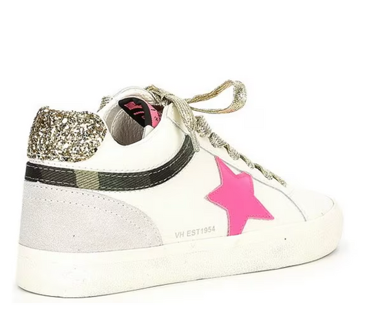 a white sneaker with a pink star on the side