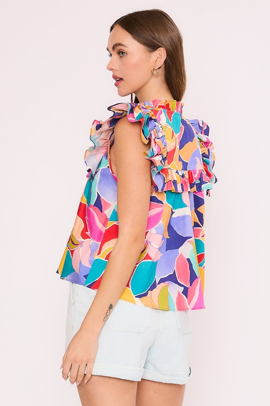 Top con pechera y volantes con estampado floral geométrico