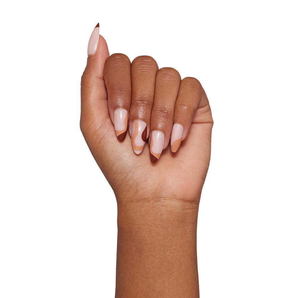 a woman's hand with a pink manicure