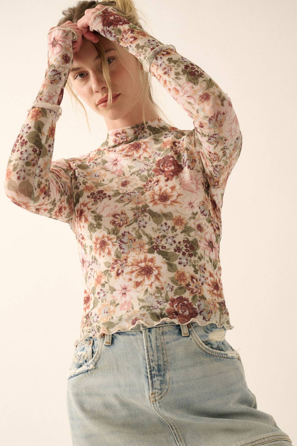 a woman is posing for a picture with her hands on her head