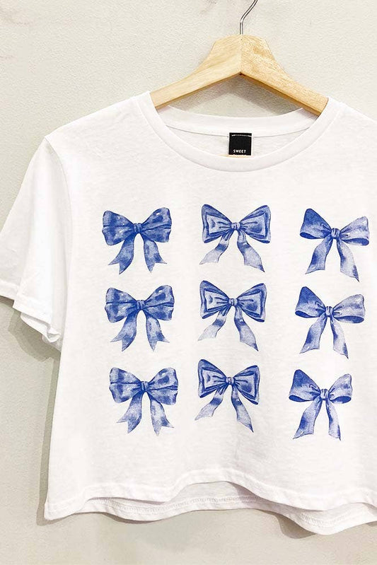 a white shirt with blue bows on it