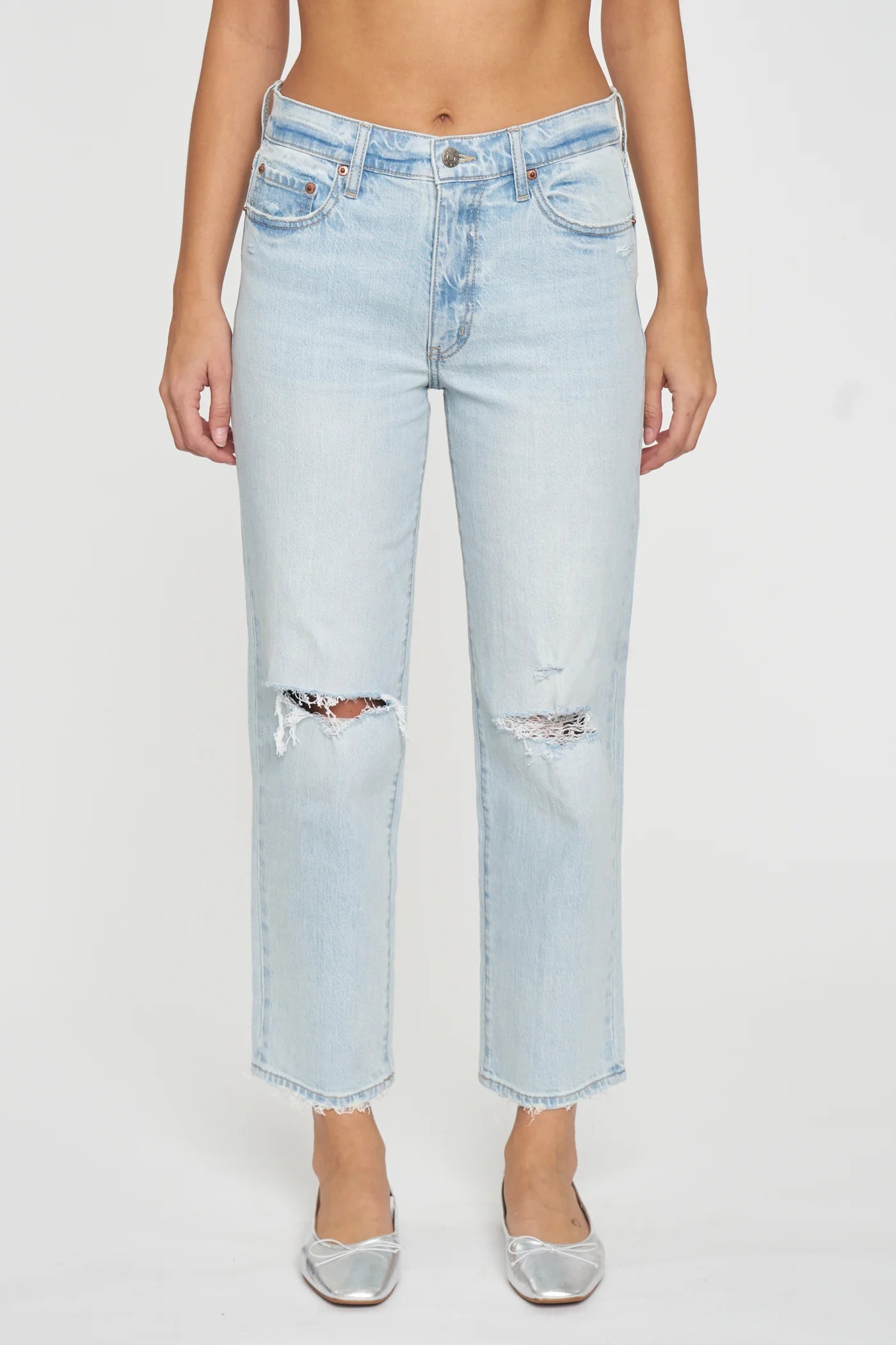 a woman is wearing a pair of light blue jeans