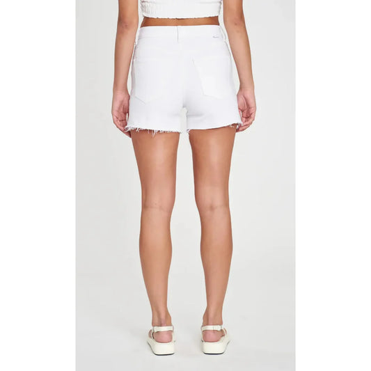 a woman wearing white shorts and a crop top