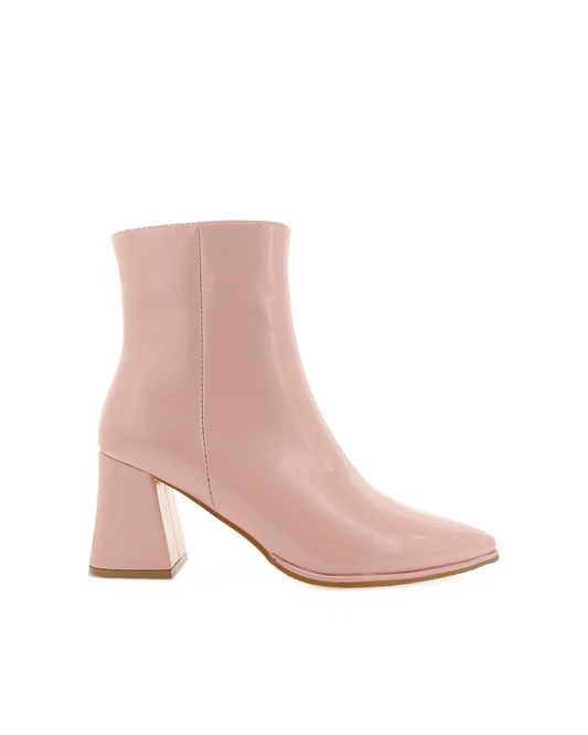 a pink ankle high boot with a block heel