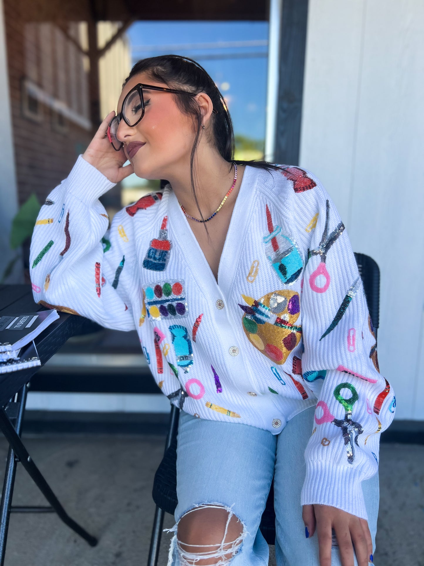 a woman sitting in a chair with headphones on