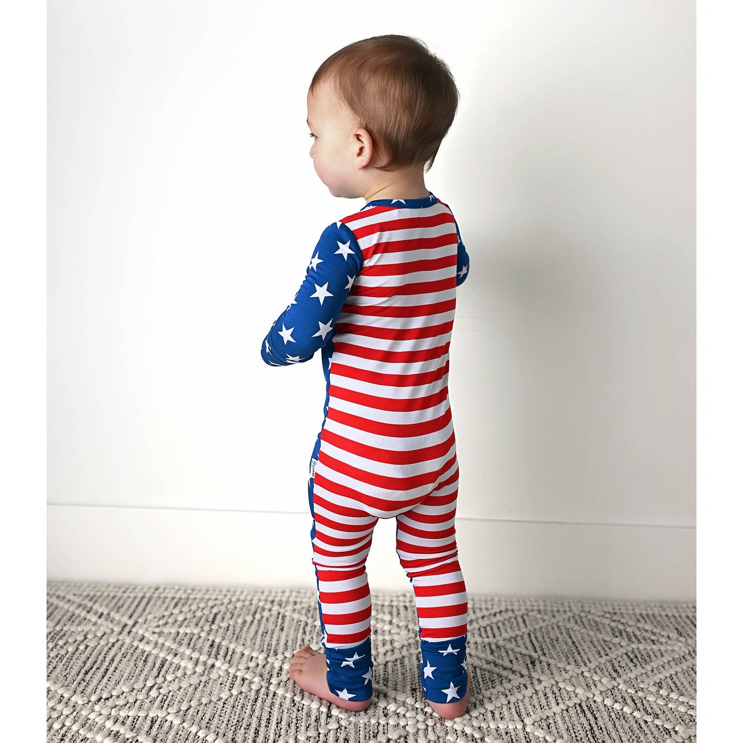 a baby in a red, white and blue american flag outfit