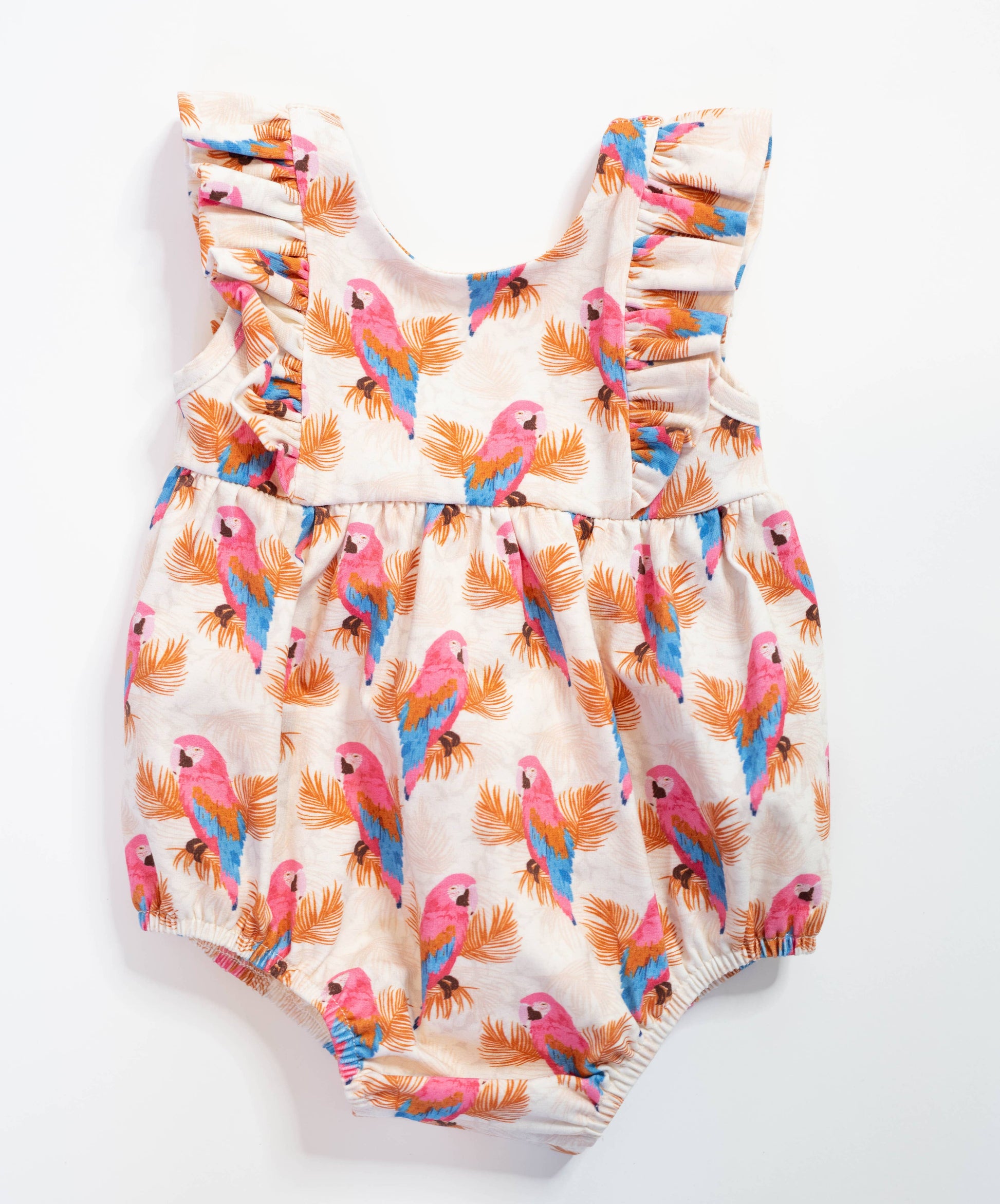 a baby romper with a pink and blue bird print on it