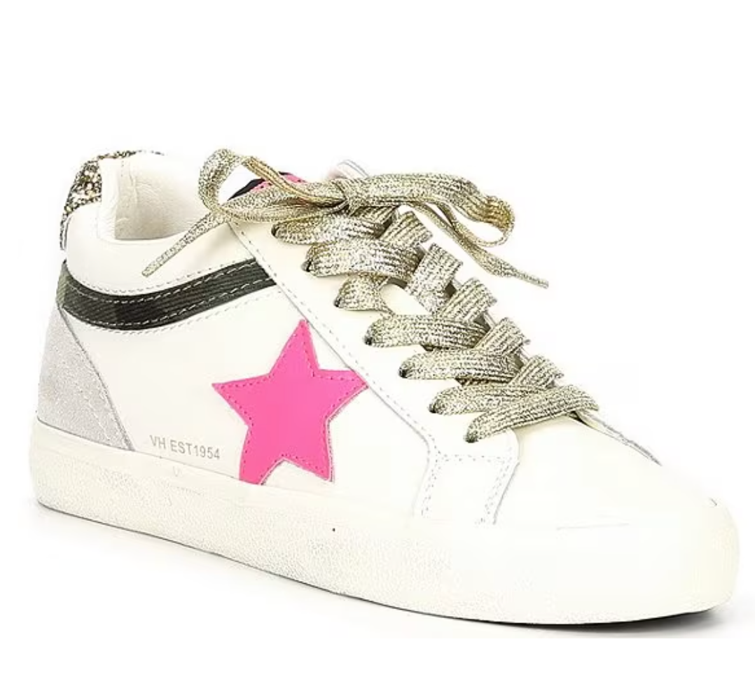 a white sneaker with a pink star on the side